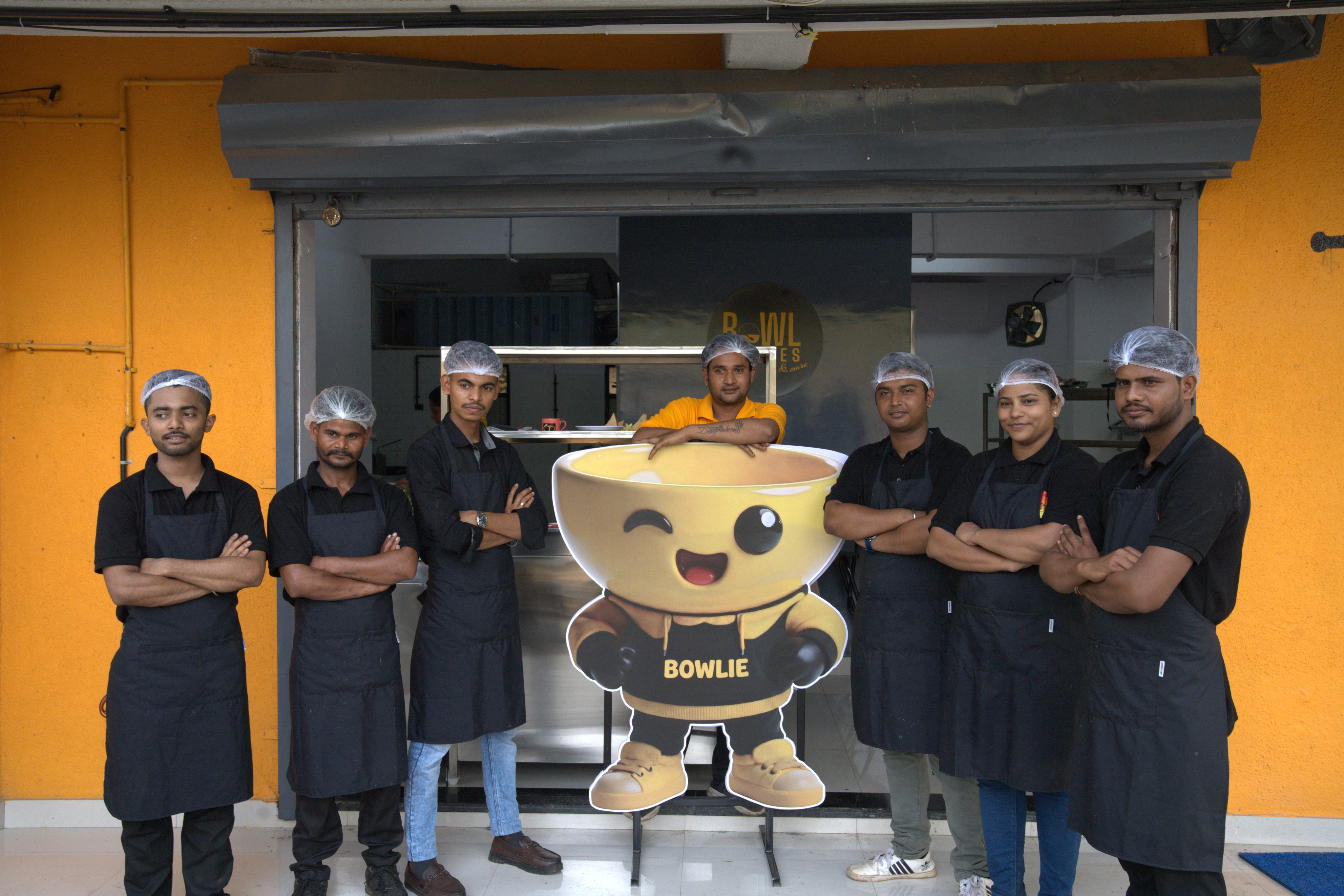 Tanri Hospitality team with Bowlie mascot